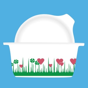 May include: White ceramic bowl with a green grass and pink heart design around the rim. The bowl has a separate lid.