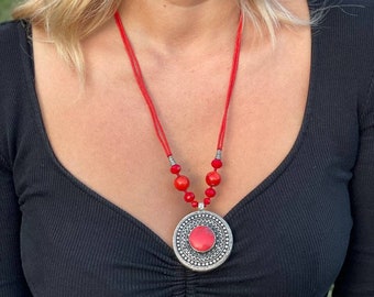 Long beaded necklace with round red coral pendant, amulet pendant, ethnic breast decoration, symbols of ethnic jewelry