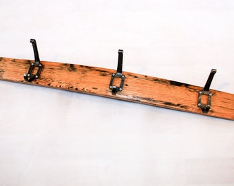 Hand Crafted Scotch Whisky Barrel Coat Hook Rack, made with label hooks. Made the way you want it!