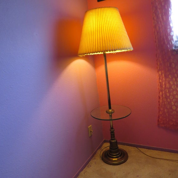 brass floor lamp with glass table