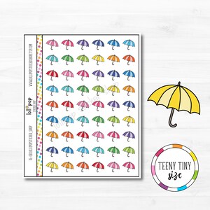 May include: A sheet of colorful umbrella stickers. The sheet has 36 small, colorful umbrellas with white backgrounds. There is a larger yellow umbrella on the right side of the sheet. The text "TEENY TINY size" is in a circle below the yellow umbrella.