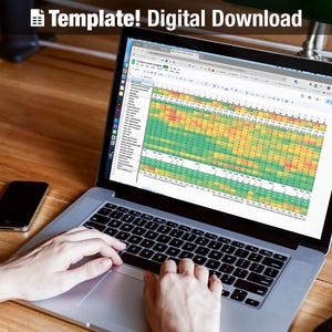 May include: A laptop displaying a spreadsheet with a color-coded data analysis. The screen shows a grid of cells with green, yellow, and red highlights. The text "Template! Digital Download" is at the top. A black smartphone sits to the left of the laptop.