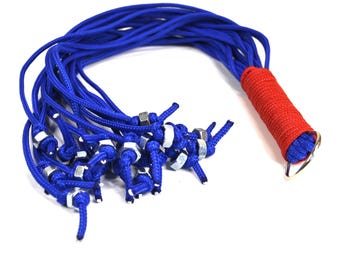 Paracord Flogger in Blue 20 falls 18 inches long. With metal nuts at the end of each fall for extra sting!