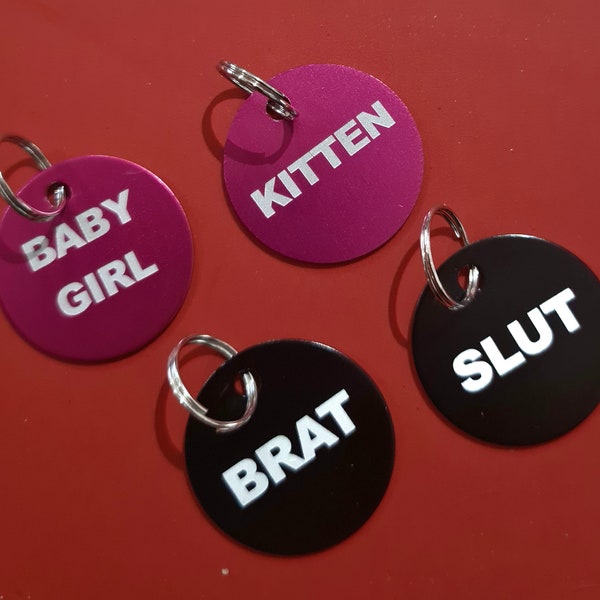 BDSM collar tag Babygirl, Kitten, Slut Brat, or your own choice of lettering. Ideal for your collar or Keyrings, play-bags, backpacks, etc.