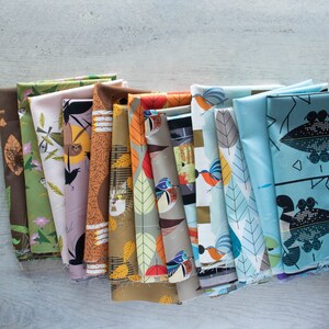 May include: A collection of 14 fabric swatches featuring a variety of colorful patterns with birds, leaves, and geometric designs. The fabrics are arranged in a row, with the most colorful fabrics at the front and the more muted fabrics at the back.