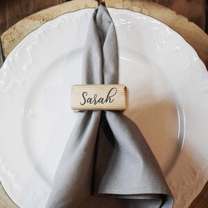 12 engraved wooden napkin rings. Made of old reclaimed wood.