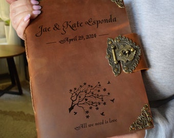 May include: A brown leather journal with a lock and key, personalized with the names "Jae & Kate Esponda" and the date "April 29, 2024". The journal also features a tree with birds and the text "All we need is love".