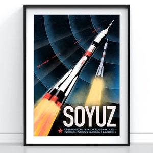 May include: A retro-style poster featuring a stylised illustration of a Soyuz rocket launching into space. The poster is in red, white, and blue with a black background. The text on the poster reads "SOYUZ" and "OPYTNOE KONSTRUKTORSKOE BYURO (OKB1) SPECIAL DESIGN BUREAU NUMBER 1".