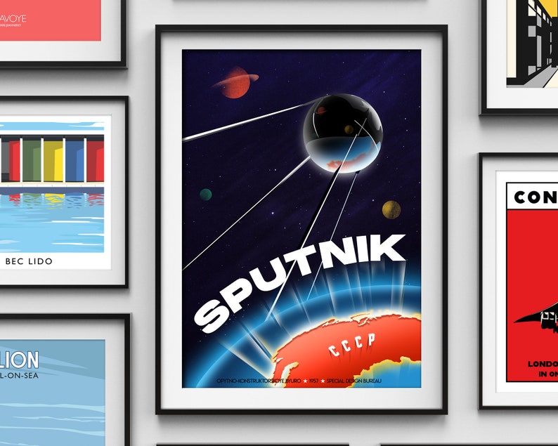 May include: A retro-style poster with a blue and white illustration of a satellite orbiting Earth. The satellite is labeled "SPUTNIK" in white letters. The Earth is red and orange with the letters "CCCP" in white. The poster has a dark blue background with stars and a red planet in the upper left corner.