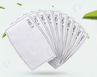 May include: A fan of white rectangular PM2.5 filter replacements. Each filter has a gray stitched border and the text "PM2.5" printed on it. The filters are arranged in a semi-circle, with a soft, blurred background.