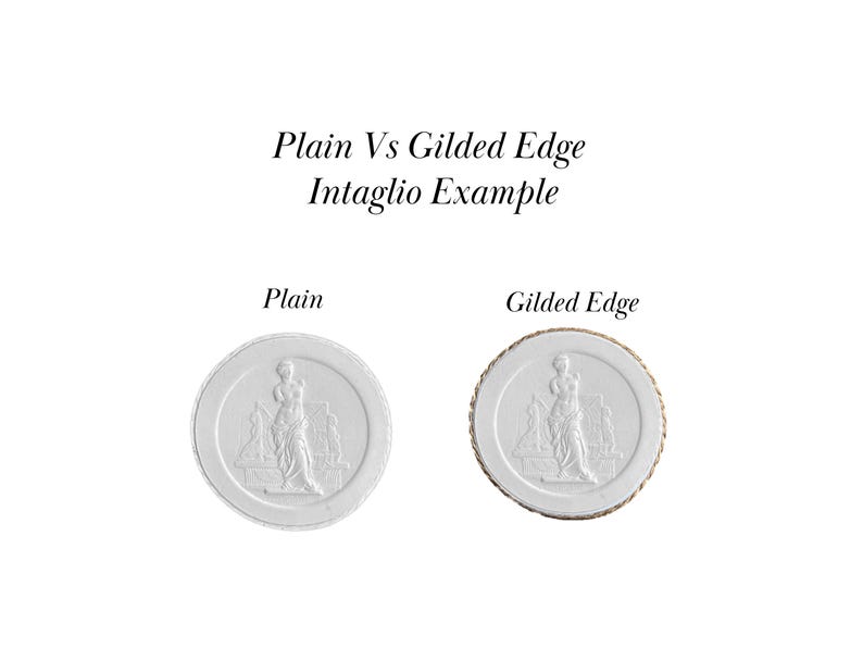 May include: Two white ceramic round plaques with an intaglio design of a woman standing. The plaque on the left has a plain edge, while the plaque on the right has a gilded edge. The text "Plain Vs Gilded Edge Intaglio Example" is above the plaques. The text "Plain" is below the left plaque and the text "Gilded Edge" is below the right plaque.