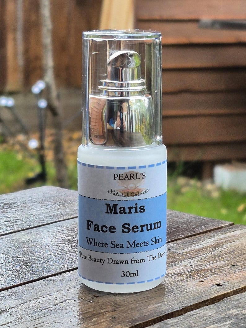 May include: A clear glass bottle of Maris Face Serum with a silver pump dispenser. The label features the text "PEARL'S Natural Cosmetic" and "Where Sea Meets Skin". The bottle contains 30ml of product.