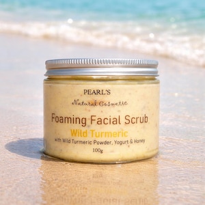May include: A clear plastic jar with a silver screw-top lid containing a pale yellow, textured foaming facial scrub. The label reads: PEARL'S Natural Cosmetic, Foaming Facial Scrub, Wild Turmeric, with Wild Turmeric Powder, Yogurt & Honey, 100g.
