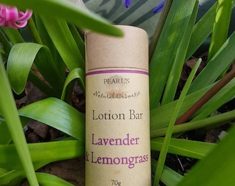 May include: A brown cardboard tube with a purple label that reads "PEARL'S Natural Cosmetic Lotion Bar Lavender & Lemongrass 70g".