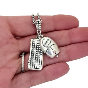 May include: Silver charm necklace with a keyboard and mouse pendant. The mouse has a heart with the word "LOVE" on it.