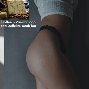 May include: A close-up of a bar of coffee and vanilla soap. The soap is light brown and has a rough texture. The text "Coffee & Vanilla Soap anti-cellulite scrub bar" is printed on the image.