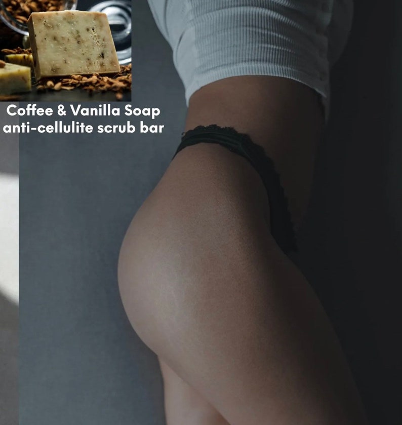 May include: A close-up of a bar of coffee and vanilla soap. The soap is light brown and has a rough texture. The text "Coffee & Vanilla Soap anti-cellulite scrub bar" is printed on the image.