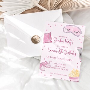 May include: A pink slumber party invitation with watercolor illustrations of a pillow, sleep mask, bunny, popcorn, and flashlight. The invitation includes the text "Join us for a Slumber Party!" and details for Emma's 8th birthday.