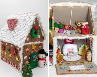 May include: A crocheted gingerbread house with white 'snow' on the roof and decorative candy canes. The house is adorned with a wreath, stars, and a snowman. Inside, there are miniature crocheted gifts and a teddy bear, creating a festive holiday scene.