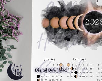 Könnte beinhalten: Digitaler Download-Kalender für 2026 mit einem Himmels-Thema. Das Design zeigt Mondphasen in Gold- und Weißtönen vor einem dunklen Aquarellhintergrund. Der Kalender enthält die Monate Januar und Februar.