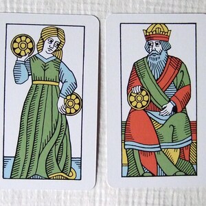 Great Parade tarot, greener edition, female jack and king of coins.