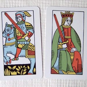 Great Parade tarot, greener edition, knight and queen of swords.