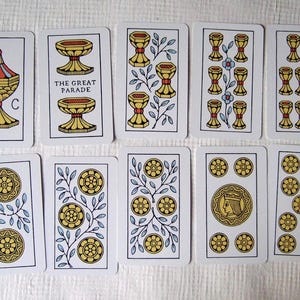 Great Parade tarot, greener edition, some of the cups and coins pip cards.