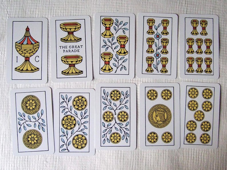 Great Parade tarot, greener edition, some of the cups and coins pip cards.