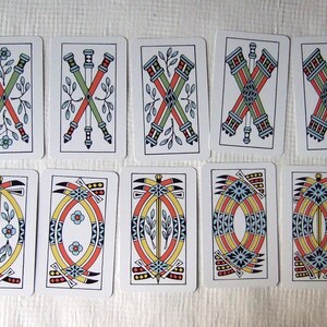 Great Parade tarot, greener edition, some of the clubs and swords pip cards.