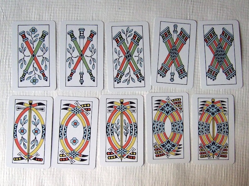 Great Parade tarot, greener edition, some of the clubs and swords pip cards.