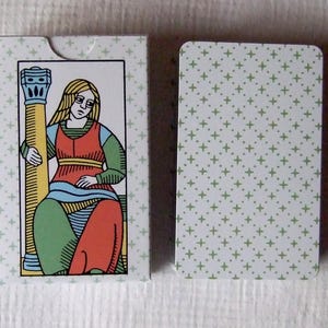 Great Parade tarot, greener edition, tuck box and card back.