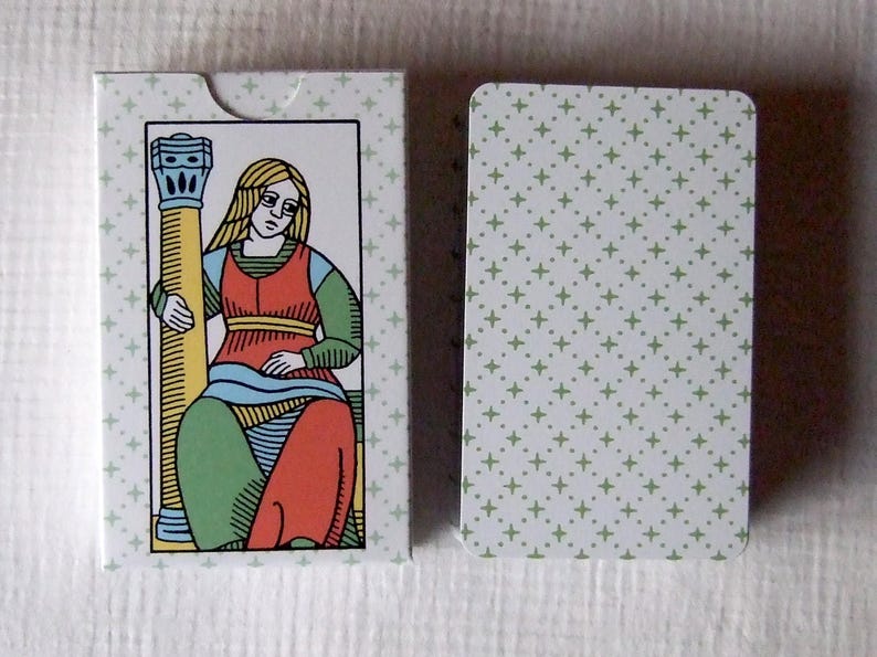 Great Parade tarot, greener edition, tuck box and card back.
