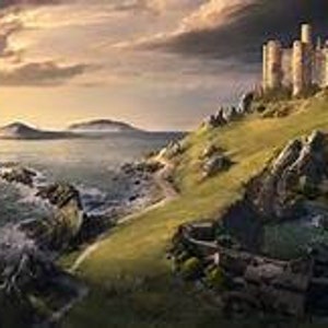 May include: A large stone castle sits atop a green hill overlooking a body of water. The sky is cloudy and the sun is setting in the distance.