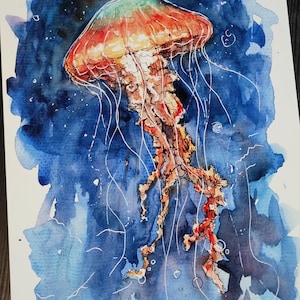 May include: Watercolor painting of a jellyfish with a red, orange, and green bell and long, white tentacles. The jellyfish is swimming in a dark blue ocean with white dots.