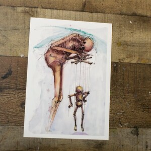 May include: A watercolor painting of a skeletal figure holding strings attached to a smaller puppet. The figure is hunched over, with its head bowed, and the puppet is standing upright with its arms outstretched. The background is a light blue watercolor wash.