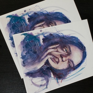 May include: A watercolor painting of a person with long dark hair, looking down with a thoughtful expression. The painting is done in shades of purple, blue, and white, with a few splashes of red. The person's hand is near their face, and the background is a soft blur of color.