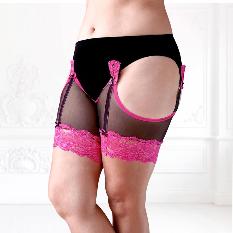 Closer side view of BaeBliss anti-chafing mesh thigh bands in black with hot pink lace, styled from lower ribs to below the knees.