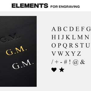 May include: A close-up of a black leather surface with the initials "G.M." engraved in gold, silver, and black. The image also shows a font chart with uppercase letters, numbers, and symbols.