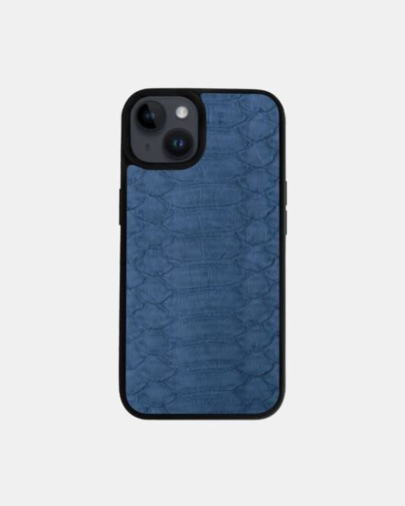 May include: A blue phone case with a textured, snakeskin-like pattern. The case has a black border and a camera cutout.