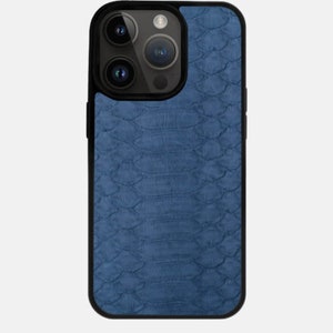 May include: A blue phone case with a textured, snake-skin pattern.
