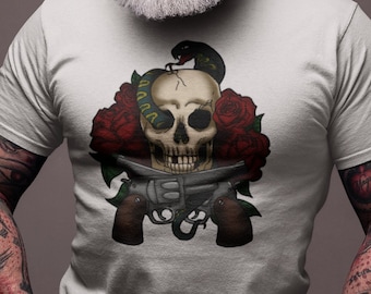 May include: A white t-shirt with a graphic print of a skull with a snake wrapped around it. The skull is surrounded by red roses and the skull is holding a pair of revolvers.