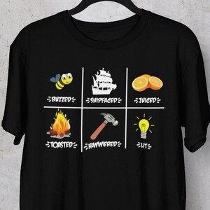 May include: Black t-shirt with a white graphic of four squares. Each square contains an emoji and a phrase. The phrases are "Buzzed", "Shipfaced", "Juiced", "Tosted", "Hammered", and "Lit".