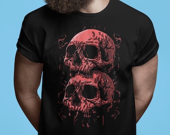 May include: A black t-shirt with a graphic of two red skulls stacked on top of each other. The skulls are detailed and have a gothic style.