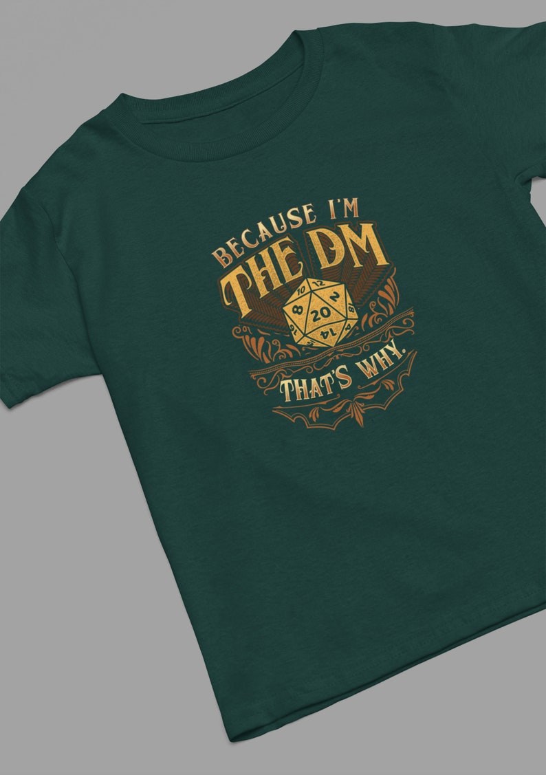 May include: A green t-shirt with a gold design that says "Because I'm the DM That's Why." The design features a 20-sided die.