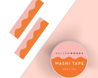 May include: A roll of pink and orange washi tape with a wavy pattern. The tape is packaged in a round container with the text "MELLOWWORKS WASHI TAPE 15mm x 10m".