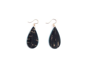 Teardrop earrings made of cork. Black with gold flecks, and teal edges. Lightweight and natural jewelry.