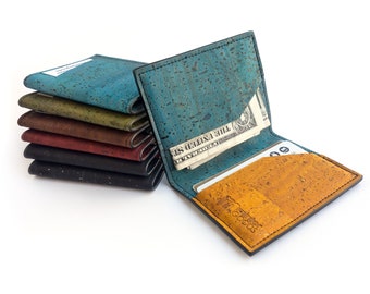 Vegan slim wallet made with blue and mustard yellow cork fabric. Small card holder, folding wallet.