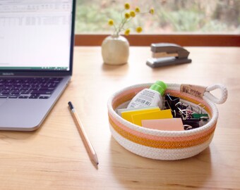 Small rope basket with painted stripes. Key and trinket bowl. Cotton clothesline basket. Entryway and foyer storage.