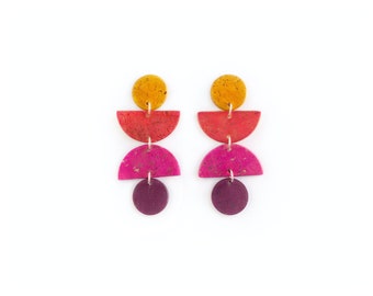 Swingy, geometric cork earrings. Bold colors, lightweight statement jewelry. Mustard yellow, red, pink and violet cork leather jewelry.