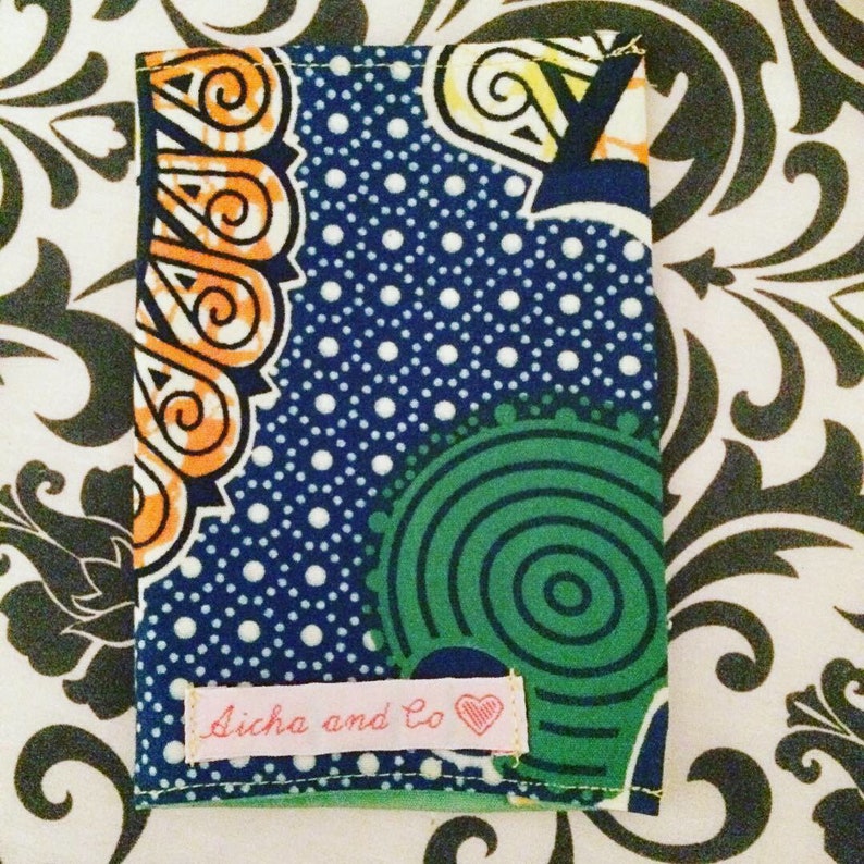 Prot\u00e9g\u00e9 Passport wax blue green yellow orange umbrella
